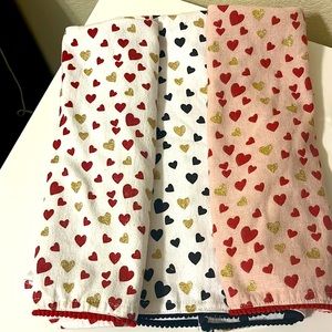 3 heart themed kitchen towels.